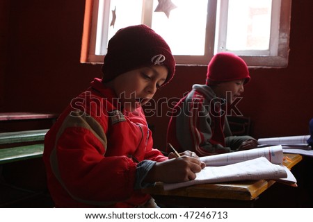 KATHMANDU, NEPAL - JANUARY 1: Pupil in a learning session during lesson in small primary school \