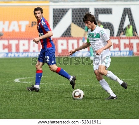 MOSCOW - MAY 10: CSKA\'s Evgeniy Aldonin (L) in action during their team\'s Russian football championship game CSKA (Moscow) vs. Terek (Grozny) - (4:1), May 10, 2010 in Moscow, Russia.