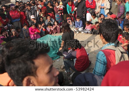 KATHMANDU, NEPAL - JANUARY 3: Circus performers give an idea on the street in poor area of city, January 3, 2009 in Kathmandu, Nepal.
