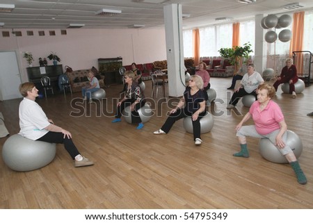 PODPOROZHYE, RUSSIA - JUNE 4: Day of Health in Center of social services for pensioners and the disabled Otrada (gymnastics with ball for elders), June 4, 2010 in Podporozhye, Russia.