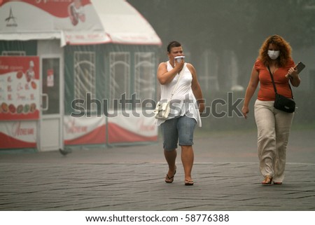 MOSCOW - AUGUST 7: Masked residents seeking to protect their respiratory channels as the carbon monoxide content in the air is increasing due to raging forest fires, August 7, 2010 in Moscow, Russia.