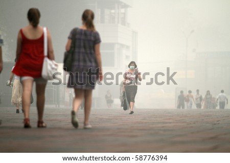 MOSCOW - AUGUST 7: Masked residents seeking to protect their respiratory channels as the carbon monoxide content in the air is increasing due to raging forest fires, August 7, 2010 in Moscow, Russia.