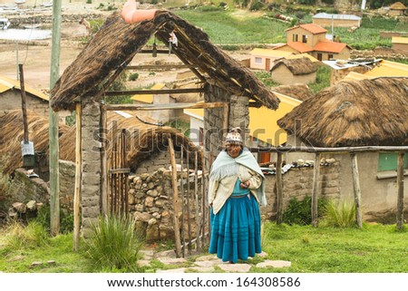 ISLA DEL SOL, BOLIVIA - JAN 21: Unidentified local Aymara woman in his village, Jan 21, 2011 on Isla del Sol, Bolivia. Main economic activity of 800 families on island is farming, fishing and tourism.