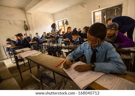 Kathmandu, Nepal - Dec 19: Unknown Children In The Lesson At Public School, Dec 19, 2013 In Kathmandu, Nepal. Adult Literacy (Age 15+) 60.3% (Female: 46.3%, Male: 73%) In A 2010 Population Census.
