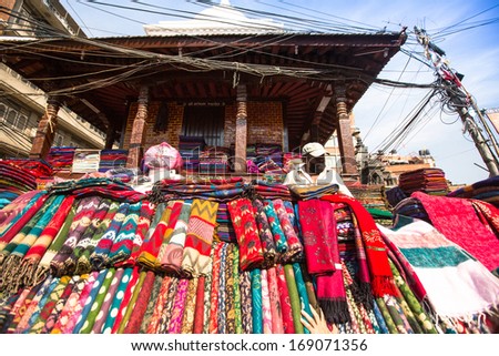 KATHMANDU, NEPAL - NOV 28: Unidentified street seller in historic center of city, Nov 28, 2013 in Kathmandu, Nepal. Largest city of Nepal, its economic center, a population of over 1 million people.