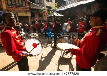 KATHMANDU, NEPAL - NOV 28: Unidentified musicians in traditional Nepalese wedding, Nov 28, 2013 in Kathmandu, Nepal. Largest city of Nepal, its cultural center, a population of over 1 million people.