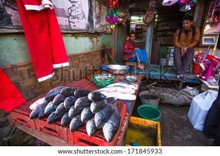 KATHMANDU, NEPAL - DEC 18: Unidentified street vendor in historic center of city, Dec 18, 2013 in Kathmandu, Nepal. Largest city of Nepal, its historic center, a population of over 1 million people.