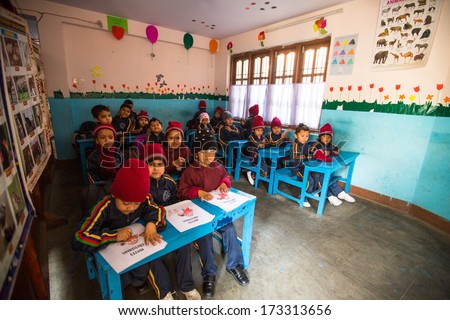 KATHMANDU, NEPAL - DEC 24: Unknown pupils in English class at primary school, Dec 24, 2013 in Kathmandu, Nepal. Only 50% of  children in Nepal can reach 5 grade.