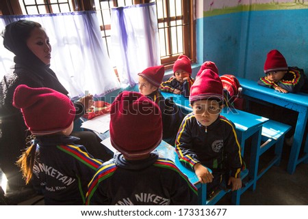KATHMANDU, NEPAL - DEC 24: Unknown pupils in English class at primary school, Dec 24, 2013 in Kathmandu, Nepal. Only 50% of  children in Nepal can reach 5 grade.