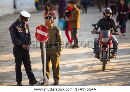 KATHMANDU, NEPAL - NOV 29: Soldiers during protest within a campaign to end violence against women (VAW), Nov 29, 2013 in Kathmandu, Nepal. Held annually since 1991, 16 days Nov 25 - Dec 10.