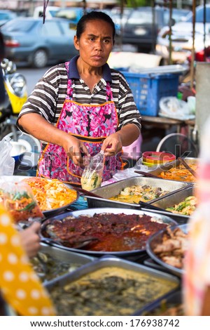 AYUTTHAYA, THAILAND - MAR 11: An unidentified street seller near Ayutthaya Historical Park on Mar 11, 2012 in Ayutthaya, Thailand.