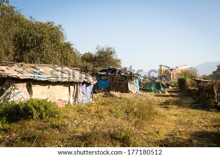 KATHMANDU, NEPAL - DEC 16, 2013: Illegal houses at slums in Tripureshwor district, Kathmandu. Caste of untouchables in Nepal, is about 7 % of population.