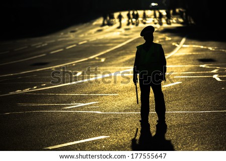 MOSCOW - JUNE 13, 2013: Silhouette of road policemen regulating traffic jam on the city center. Moscow Mayor Sobyanin reconstructs suburban railways, to solve problem of traffic jams in 2016.