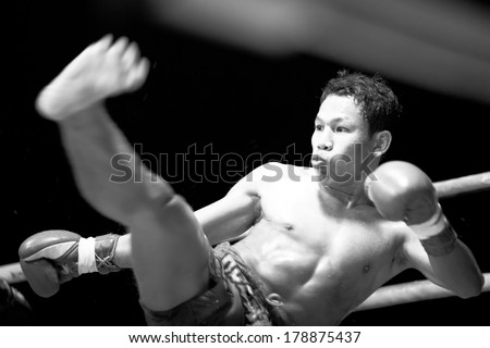 CHANG, THAILAND - FEB 22, 2013: Unidentified Muaythai fighter in ring during match (black and white series). For many Thai men, Muaythai only way to break out of poverty, per battle pay to 7000 baht.