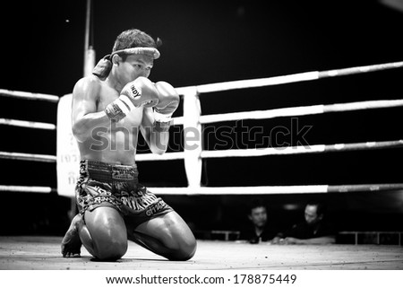 CHANG, THAILAND - FEB 22, 2013: Unidentified Muaythai fighter in ring during match (black and white series). For many Thai men, Muaythai only way to break out of poverty, per battle pay to 7000 baht.