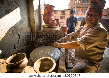 BHAKTAOUR, NEPAL - DEC 7: Unidentified Nepalese man working in the his pottery workshop, Dec 7, 2013 in Bhaktapur, Nepal. 100 cultural groups have created an image Bhaktapur as Capital of Nepal Arts.