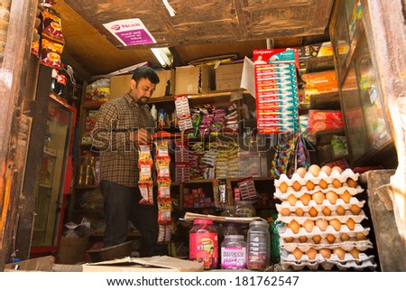 KATHMANDU, NEPAL - NOV 28: Unidentified street vendor in historic center of city, Nov 28, 2013 in Kathmandu, Nepal. Largest city of Nepal, its historic center, a population of over 1 million people.