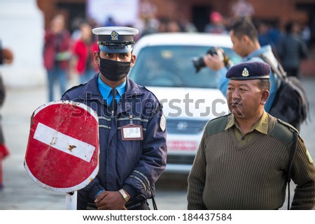 KATHMANDU, NEPAL - NOV 29, 2013: Soldiers during protest within a campaign to end violence against women (VAW) Held annually since 1991, 16 days from Nov 25 to Dec 10.