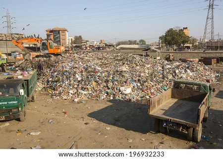 KATHMANDU, NEPAL - DEC 22, 2013: Food and pile of domestic garbage in landfill. Only 35% of population have access to adequate sanitation.