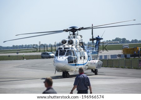 BERLIN, GERMANY - MAY 20 , 2014 : Arrival in a helicopter of German Chancellor Angela Merkel on open up the International aviation and space exhibition ILA.