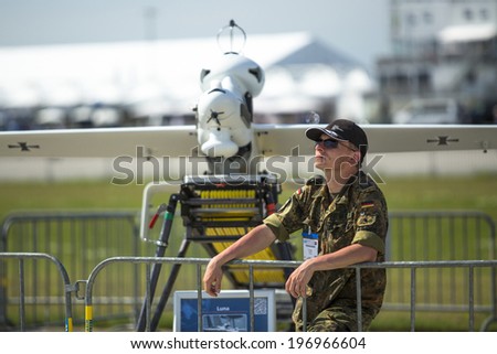 BERLIN, GERMANY - MAY 20, 2014: Unidentified participants staff during the International Aerospace Exhibition ILA Berlin Air Show-2014.