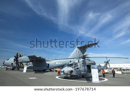 BERLIN, GERMANY - MAY 20, 2014: Multi-role military helicopter NH90 for Army use and the naval NATO Frigate Helicopter (NFH), demonstration during the Aerospace Exhibition ILA Berlin Air Show.