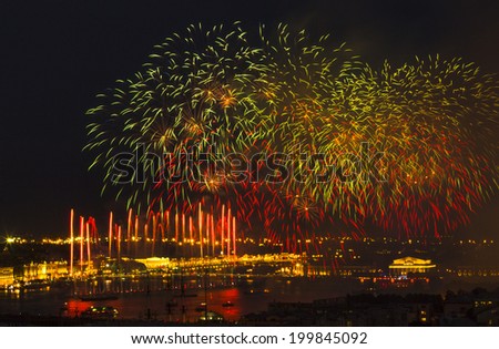 ST.PETERSBURG, RUSSIA - JUN 20, 2014: Light show and firework with a frigate with scarlet sails floating on the Neva River. In 2014, the festival Scarlet Sails celebrates its tenth anniversary.
