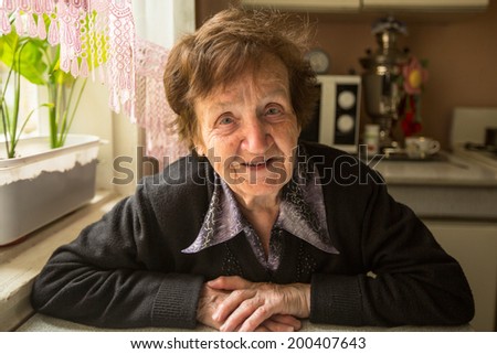 Portrait of the smiling elderly woman.