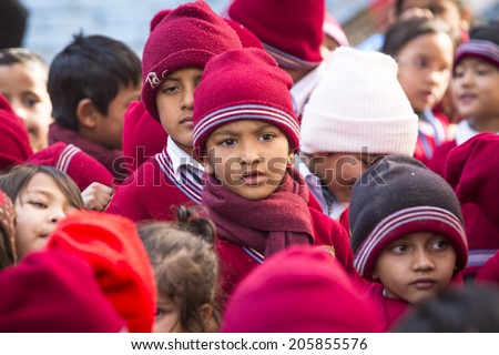KATHMANDU, NEPAL - DEC 22, 2013: Unknown pupils during dance lesson in primary school. Only only 25% of girls attend schools and half of the children can reach the 5 grade.