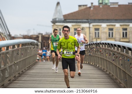 KRAKOW, POLAND - MAR 23, 2014: Unidentified participants during the annual Krakow international Marathon. Krakow Marathon conducted since 2002 under the slogan: With history in the background.