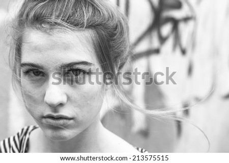 Fashionable girl close-up portrait, black and white photo.
