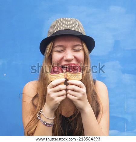 Young fun emotional cute hipster girl with ice cream.