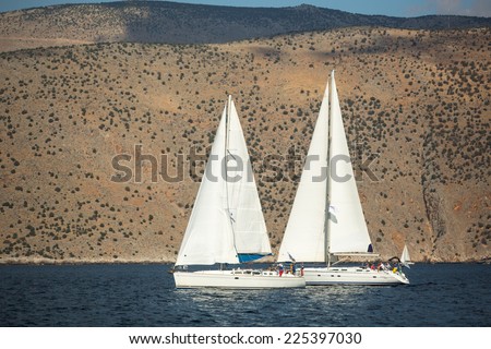 GALAXIDI, GREECE - SEP 29, 2014: Unidentified sailboats participate in sailing regatta 