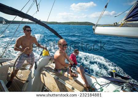 ERMIONI - POROS, GREECE - OCT 9, 2014: Unidentified sailors participate in sailing regatta \