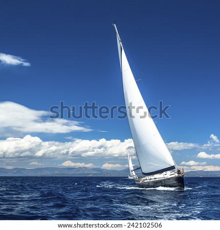 Yacht sails with beautiful cloudless sky. Sailing. Luxury yacht.