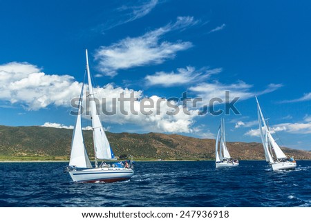 HYDRA, GREECE - CIRCA OCT, 2014: Unidentified sailboats participate in sailing regatta 12th Ellada Autumn 2014 among Greek island group in the Aegean Sea, in Cyclades and Argo-Saronic Gulf.