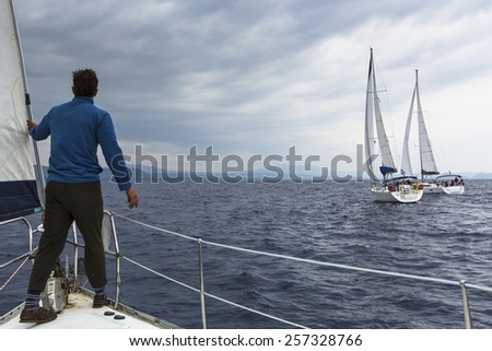 HYDRA, GREECE - CIRCA OCT, 2014: Unidentified sailboats participate in sailing regatta 12th Ellada Autumn 2014 among Greek island group in the Aegean Sea, in Cyclades and Argo-Saronic Gulf.