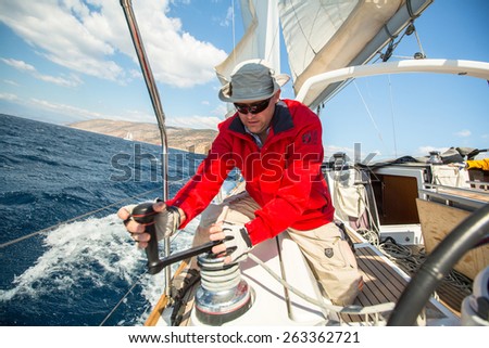 HYDRA, GREECE - CIRCA OCT, 2014: Sailors participate in sailing regatta 12th Ellada Autumn 2014 among Greek island group in the Aegean Sea, in Cyclades and Argo-Saronic Gulf.