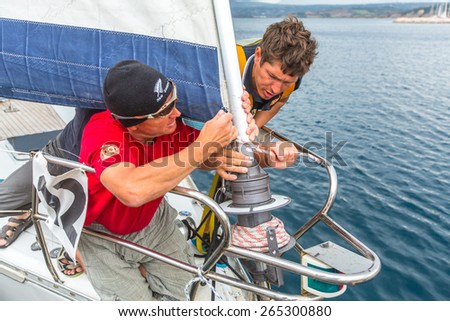 ANDROS, GREECE - CIRCA OCT, 2014: Sailors participate in sailing regatta 12th Ellada Autumn 2014 among Greek island group in the Aegean Sea, in Cyclades and Argo-Saronic Gulf.
