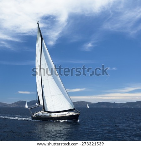 Sailing. Yacht sails with beautiful cloudless sky. Luxury yacht.