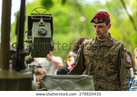KRAKOW, POLAND - MAY 3, 2015: Polish soldier during demonstration of the military and rescue equipment in the framework annual Polish national and public holiday the Constitution Day May 3rd.