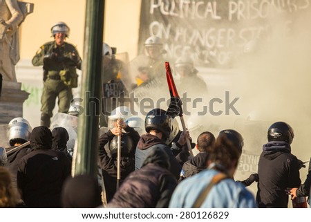 ATHENS, GREECE - CIRCA APR, 2015: Leftist and anarchist groups seeking abolition of new maximum security prisons, clashed with riot police, who responded with tear gas and stun grenades.