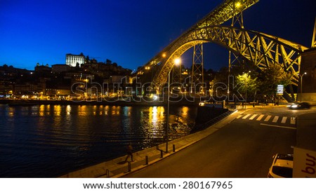 PORTO, PORTUGAL - MAY 15, 2015: View of Porto and the Dom Luiz bridge at night time. Porto is called Northern capital of Portugal. Municipality was founded in 1123. UNESCO World Heritage.