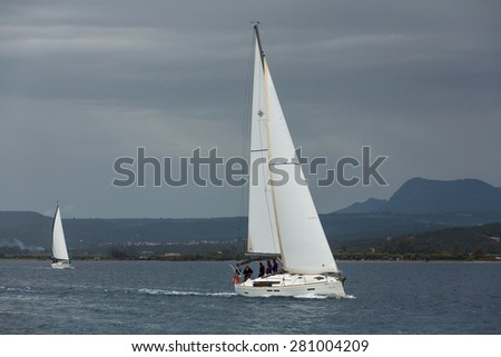 PYLOS, GREECE - CIRCA OCT, 2014: Sailboats participate in sailing regatta 12th Ellada Autumn 2014 among Greek island group in the Aegean Sea, in Cyclades and Argo-Saronic Gulf.