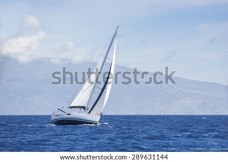 Wind in yacht sails with beautiful sky. Luxury yachts.