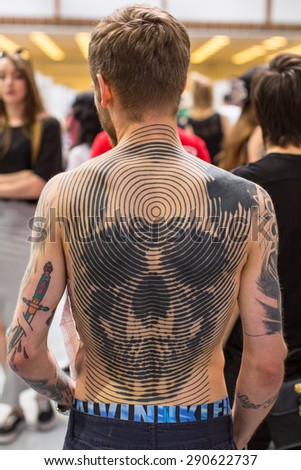 KRAKOW, POLAND - JUNE 6, 2015: Unidentified participants at 10-th International Tattoo Convention in Congress-EXPO Center. This year anniversary TattooFest - tattoo Studio is with an area of 2000m2