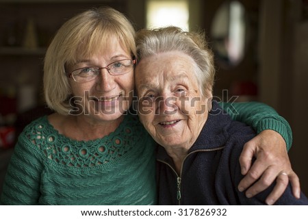 Portrait of an adult woman with his elderly mother.