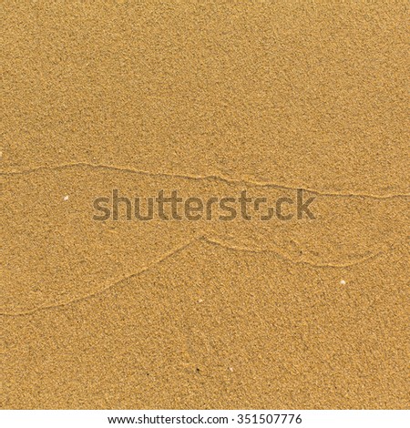 Texture is light sea beach sand.