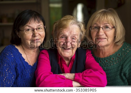 An old woman with two adult daughters.