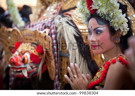 BALI, INDONESIA - APRIL 9: Young girl during a classic national Balinese dance Barong on April 9, 2012 on Bali, Indonesia. Barong is very popular cultural show on Bali.